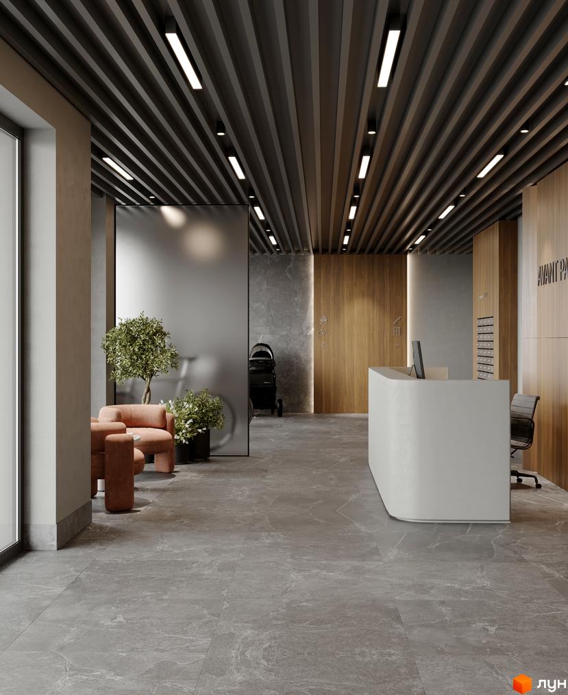 Інтер'єр лобі житлового комплексу AVANT PARK з ресепшн та зоною відпочинку. Сучасний дизайн з використанням натуральних матеріалів та рослинності.