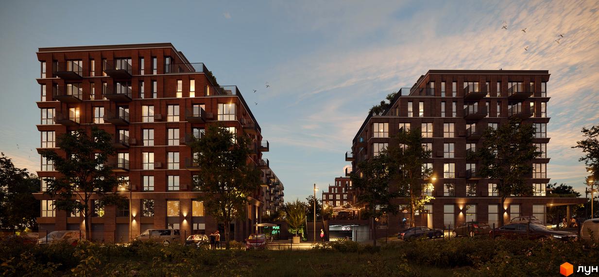 Новобудова AVANT PARK з цегляним фасадом та балконами на тлі вечірнього неба. Територія навколо комплексу озеленена деревами та освітлена ліхтарями.