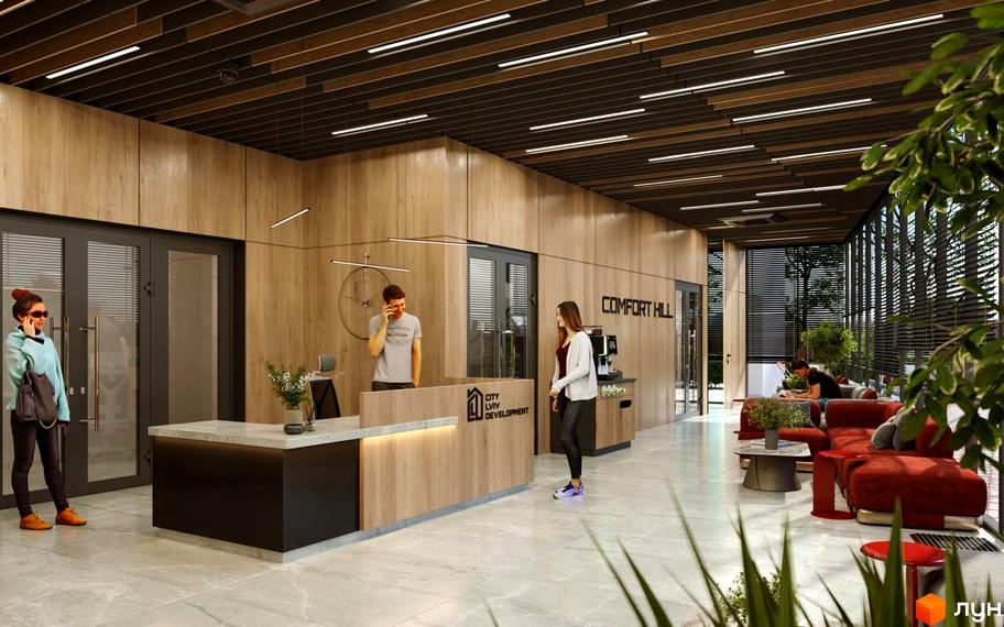 Інтер'єр холу в Житловому комплексі Comfort Hill. Стійка реєстрації, зона очікування з диванами та рослинами.