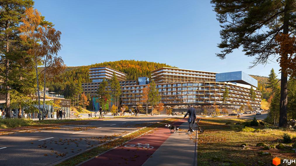 Сучасний житловий комплекс ONDE Hotel by GORO Mountain Resort з дерев'яними фасадами та скляними елементами, розташований серед осіннього лісу з дорогою та велодоріжкою.