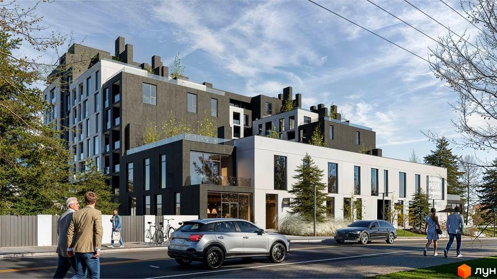 Зовнішній вигляд новобудови ЖК Мрія з фасадами темного та світлого кольору, вікнами та зеленими насадженнями на даху. Поруч дорога з автомобілями та пішоходами.