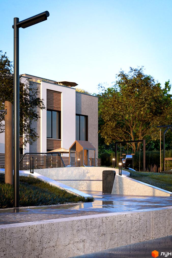 Будинок Котеджного містечка The Lake з білим та сірим фасадом, великими вікнами, а також прибудинкова територія з дитячим майданчиком та зеленими насадженнями.