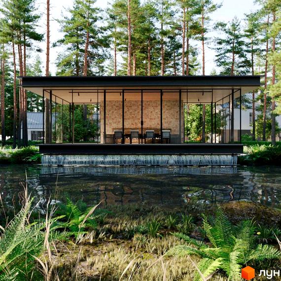 Котеджне містечко Green Village. Будинок зі скляними стінами та кам'яною кладкою, розташований над водоймою з водоспадом, оточений лісом.