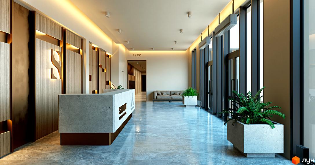 Лобі житлового комплексу SENAT з дизайнерським оздобленням стін, стійкою ресепшн та зоною відпочинку. Сучасний інтер'єр з натуральними матеріалами та рослинами.