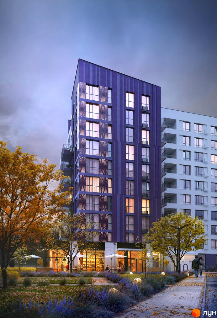 Житловий комплекс Lavanda Park з фіолетовим фасадом та білим корпусом, з освітленими вікнами та балконами, оточений деревами з жовтим листям та клумбами з синіми квітами.