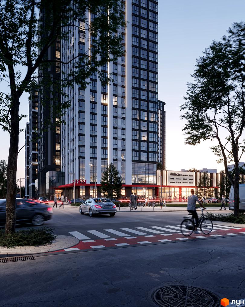 Комплекс Avalon Up з біло-чорним фасадом та великою кількістю вікон. Перед будинком розташована дорога з пішохідним переходом та зелені насадження.