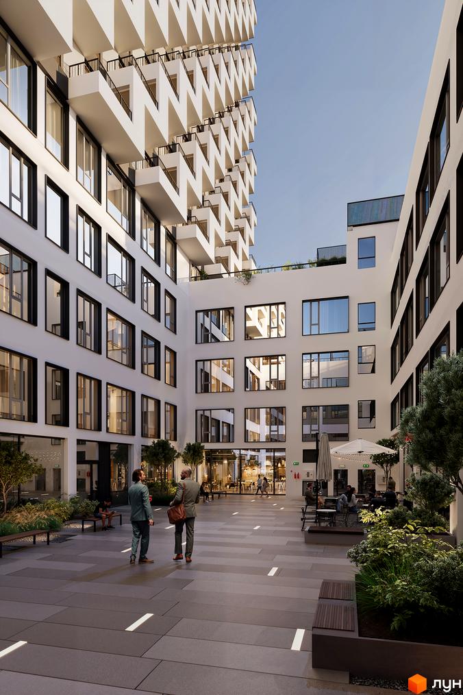 Вигляд на двір з ландшафтним дизайном та будівлі Житлового комплексу BOSTON Creative House з великими вікнами та балконами.