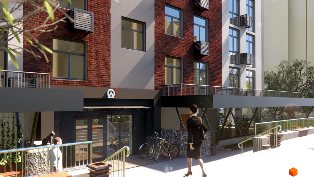 Житловий комплекс Теплий дім Plus. Фасад будівлі з цегляними та сірими вставками, вікнами та балконами. Поруч розташована прибудинкова територія з велосипедами та пішохідною зоною.