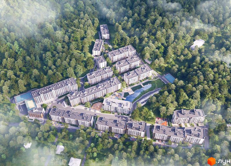 Вигляд житлового комплексу Greenwood-2 з висоти пташиного польоту. Багатоквартирні будинки з темними дахами розташовані серед лісу, на території є водойма та спортивні майданчики.