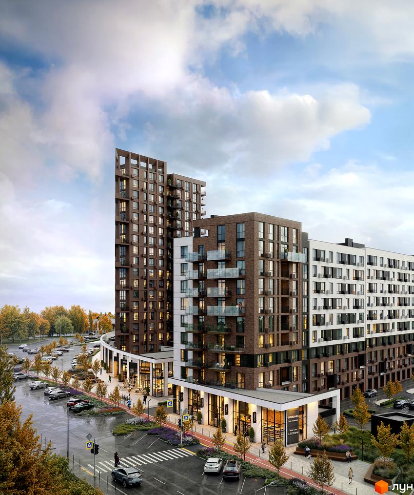 Багатоповерховий будинок з фасадом з коричневої цегли. Поруч розташована прибудинкова територія з парковкою, тротуарами та зеленими насадженнями.