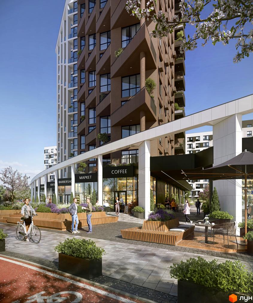 Житловий комплекс FORREST з фасадом у коричневих тонах, поруч з яким розташована зона відпочинку з лавками та зеленню.