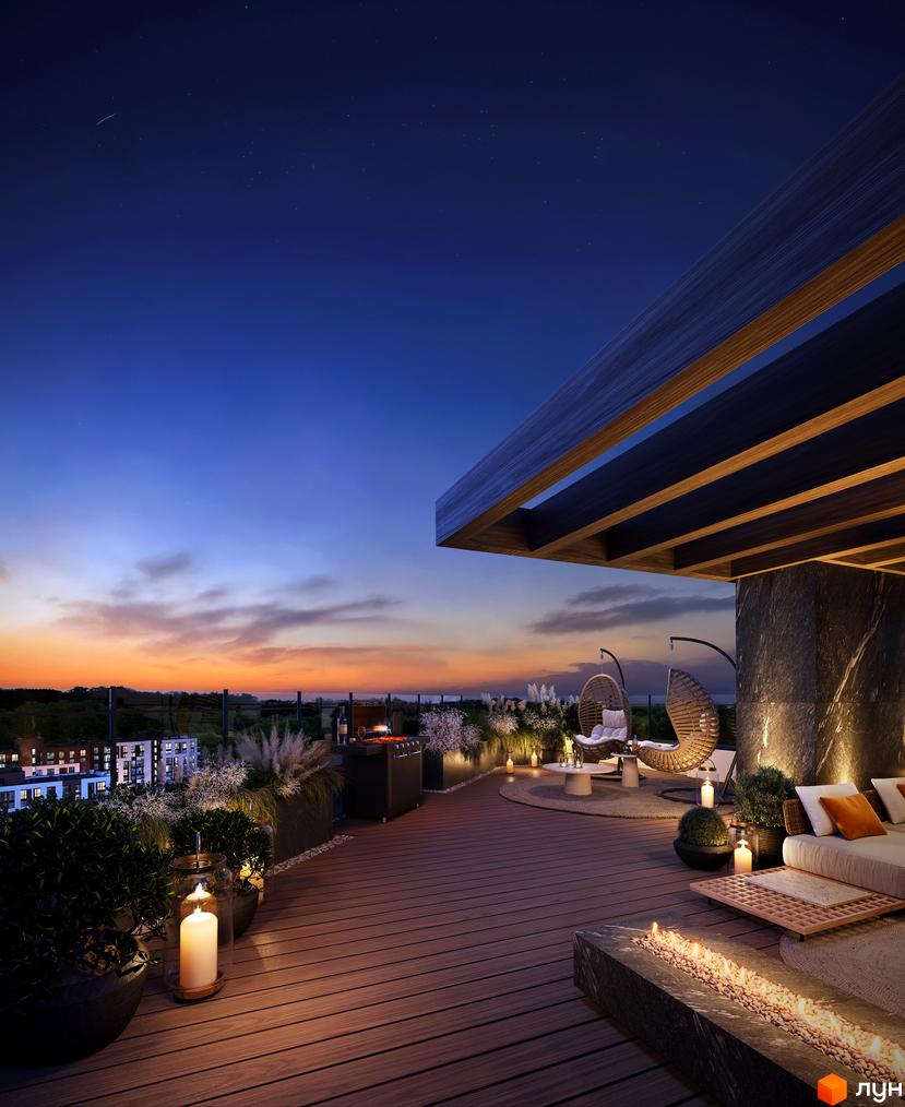 Вечірній вигляд на житловий комплекс FORREST з просторою терасою на даху, обладнаною зоною відпочинку, грилем та вогнищем.