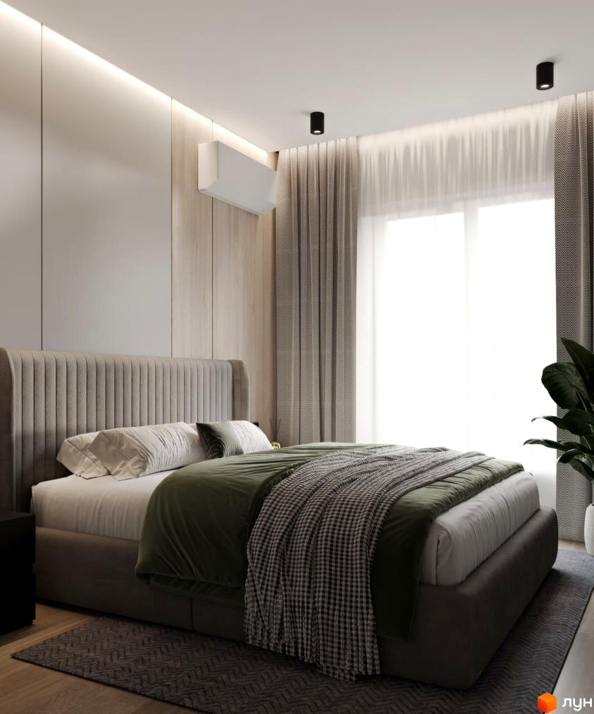 Інтер'єр спальні в житловому комплексі КМ VIVA-CHERNIVTSI. Ліжко з високим узголів'ям, зелений плед, сірі штори та приліжковий килим.