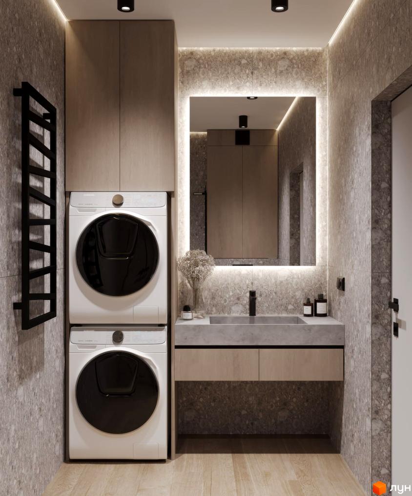 Дизайн ванної кімнати з пральною машиною та сушаркою у житловому комплексі КМ VIVA-CHERNIVTSI. Сучасний інтер'єр з сірою плиткою та підсвічуванням.