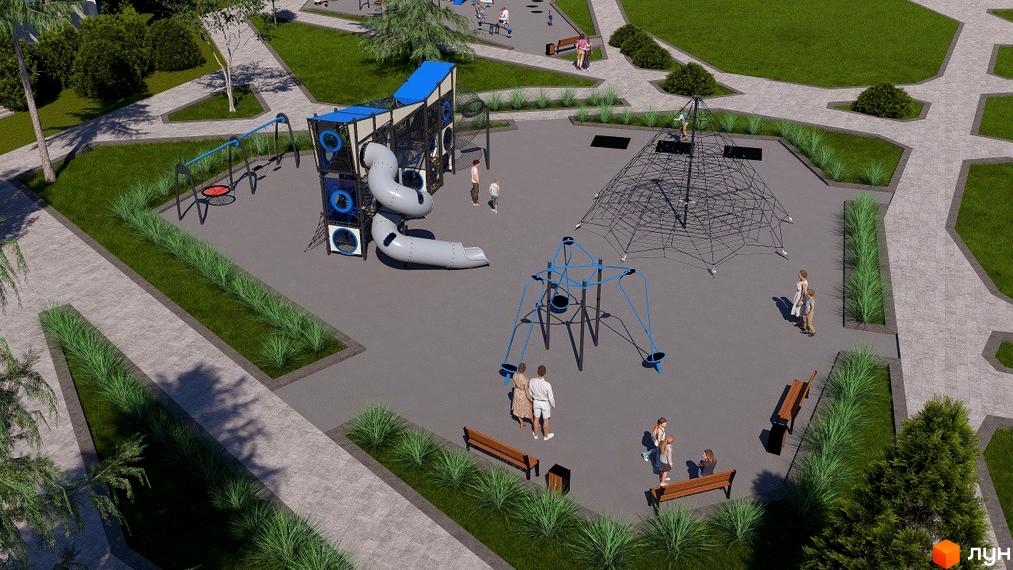 Дитячий майданчик у дворі житлового комплексу. На території є гірки, гойдалки та сітчастий лабіринт для дітей, лавки для відпочинку.