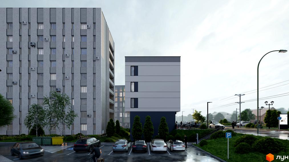 Новобудова МОККО: високі сірі будівлі з вікнами, прибудинкова територія з парковкою, деревами та вуличним освітленням.