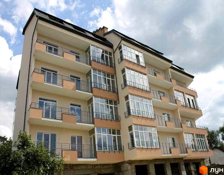 Новобудова ЖК Хвиля з балконами та великими вікнами. Зовнішній вигляд будинку з бежевим фасадом та чорним дахом.