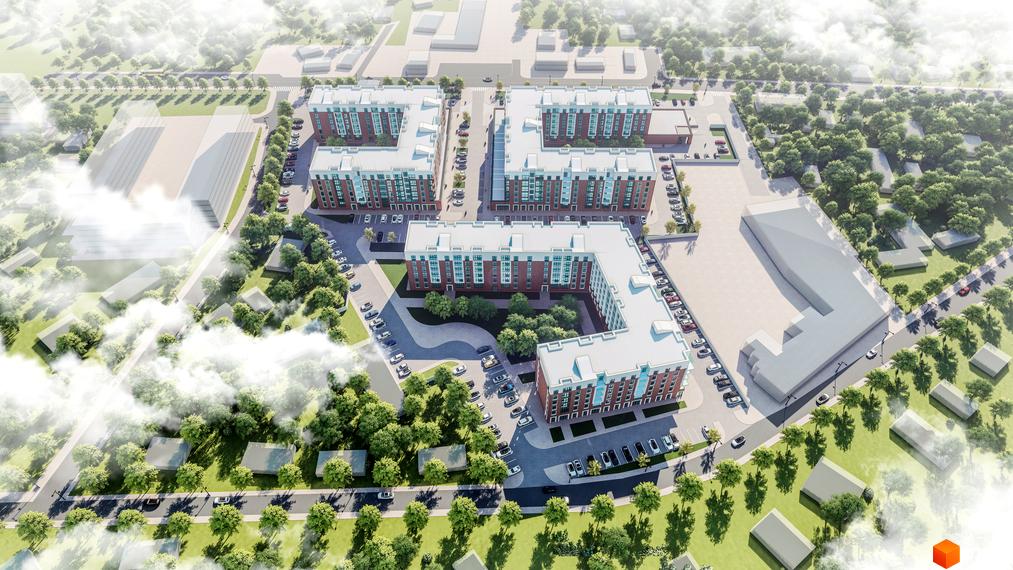 Аерофото житлового комплексу Володимир Сіті: багатоповерхові будинки з червоної цегли та світлими дахами, оточені зеленими насадженнями та парковками.