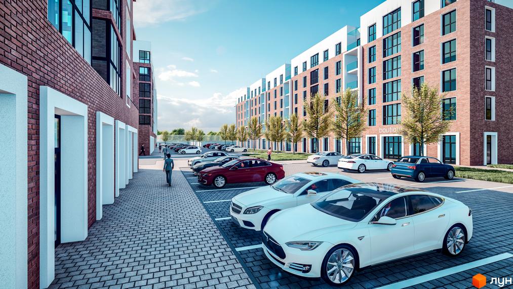 Житловий комплекс Володимир Сіті: багатоповерхові будинки з цегляними фасадами, великими вікнами та прибудинковим паркінгом з автомобілями.