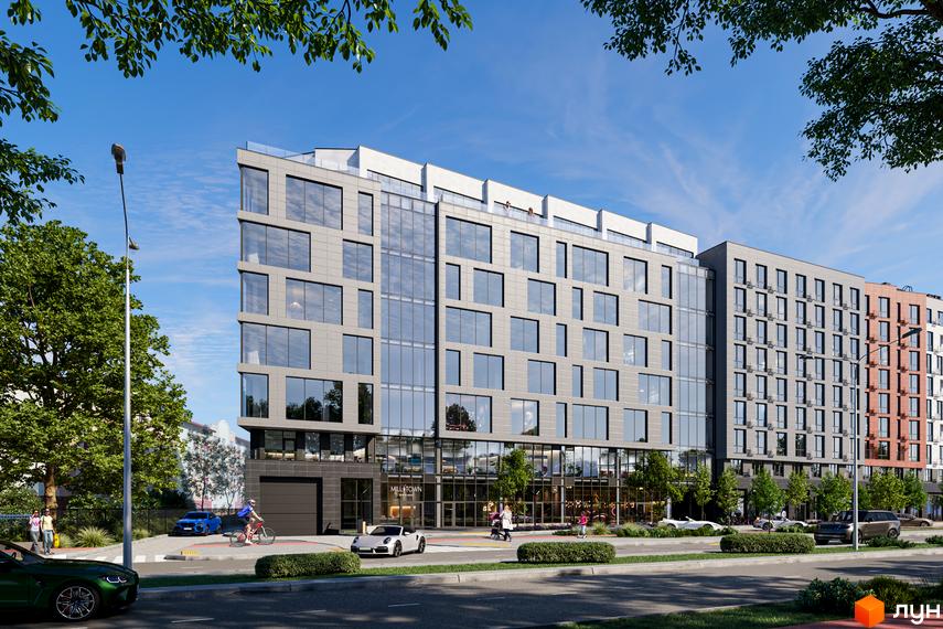 Зовнішній вигляд новобудови Mill Town з великими вікнами та сірими фасадами. Поруч розташована прибудинкова територія з деревами та дорогою.