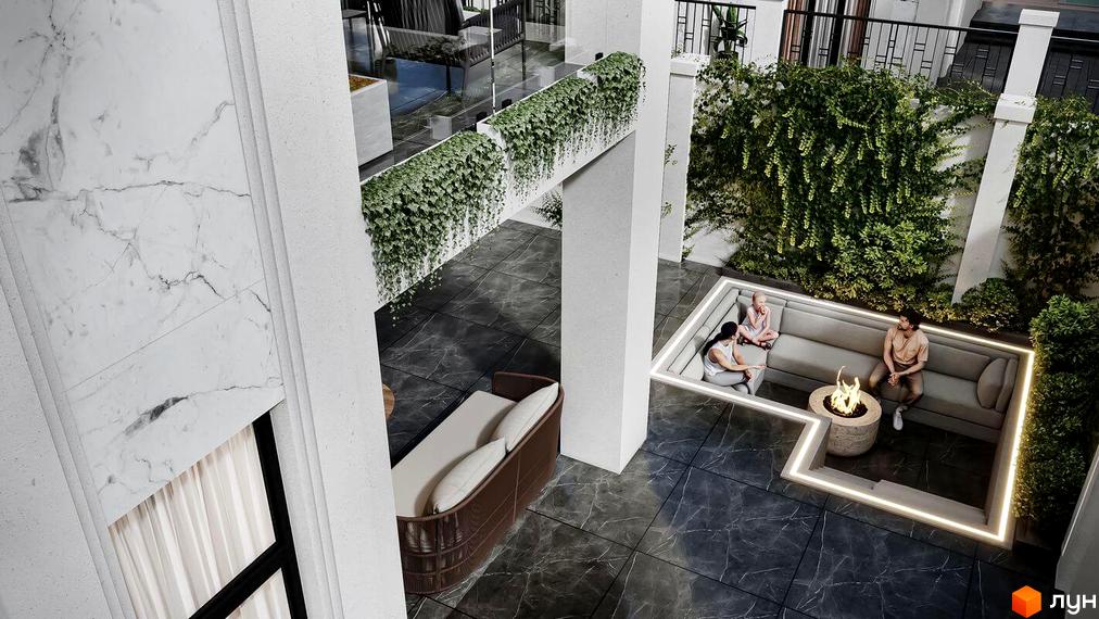 Вид на внутрішній двір Містечко котеджів МАЄТОК з зоною відпочинку з диванами та вогнищем, облицьований темною плиткою.