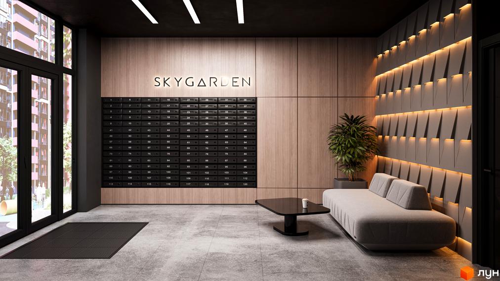 Вхідна група житлового комплексу SKYGARDEN з поштовими скриньками та диваном. Сучасний дизайн лобі новобудови.
