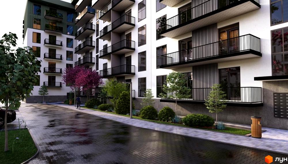 Житловий комплекс Home з білими фасадами та чорними балконами, поруч доглянута прибудинкова територія з деревами та бруківкою.