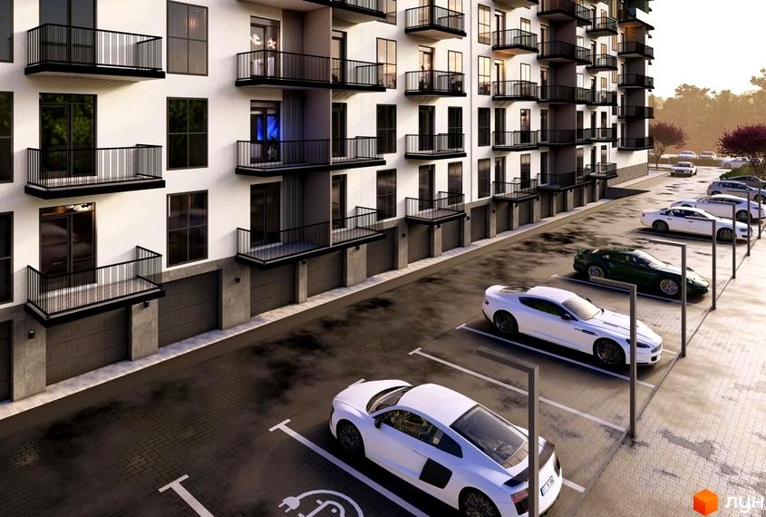 Житловий комплекс Home має світлий фасад з темними балконами та гаражами на першому поверсі. Перед будинком розташований паркінг з автомобілями.