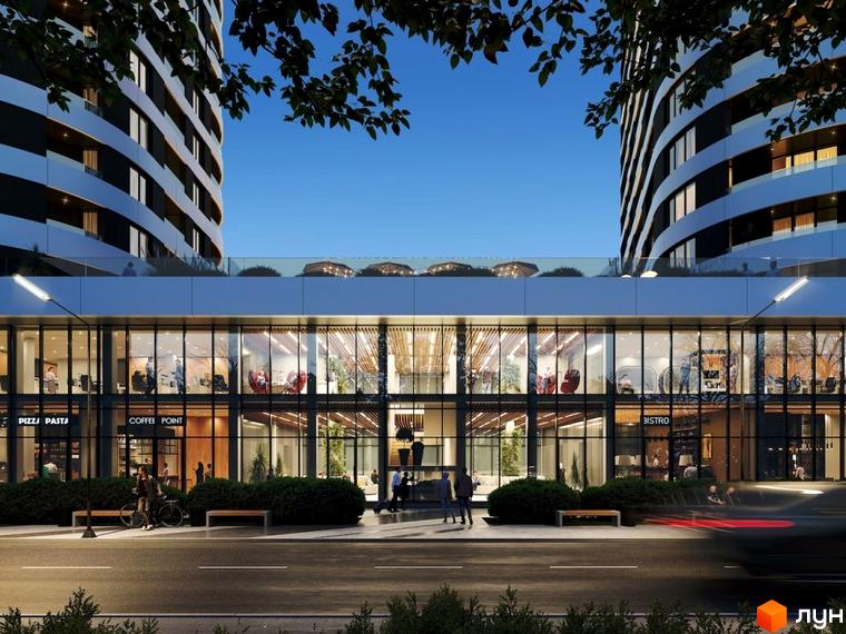 Житловий комплекс Липські вежі з двома високими будинками та комерційними приміщеннями на першому поверсі. Перед будівлею облаштована пішохідна зона з лавками та зеленню.