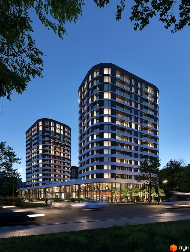 Житловий комплекс Липські вежі: дві висотні будівлі з темним фасадом та скляними балконами, освітлена прибудинкова територія з дорогою та зеленню.