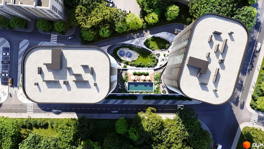 Аерофото Житлового комплексу Липські вежі з двома будівлями округлої форми. На прибудинковій території розташовані басейн, зони відпочинку та зелені насадження.