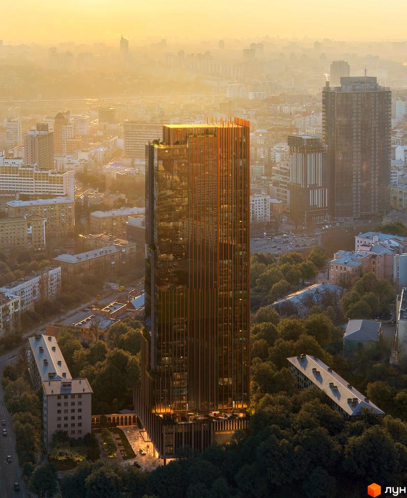 Високоякісний проєкт THE ONE з скляним фасадом та дерев'яними елементами, оточений зеленню та міською забудовою.