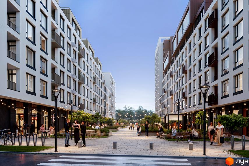 Вигляд на Житловий комплекс Зоряні з пішохідної зони. Навколо новобудови облаштована прибудинкова територія з лавками та освітленням.