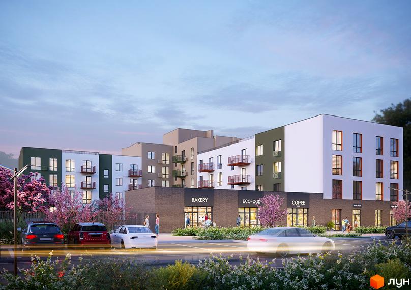 Зовнішній вигляд житлового комплексу Субурбія Дуо з магазинами на першому поверсі та парковкою. Навколо комплексу розташовані дерева та кущі.