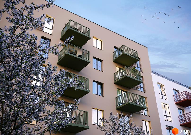 Житловий комплекс Субурбія Дуо з балконами та квітучими деревами на фоні блакитного неба. Зовнішній вигляд будинку з вікнами та балконами.