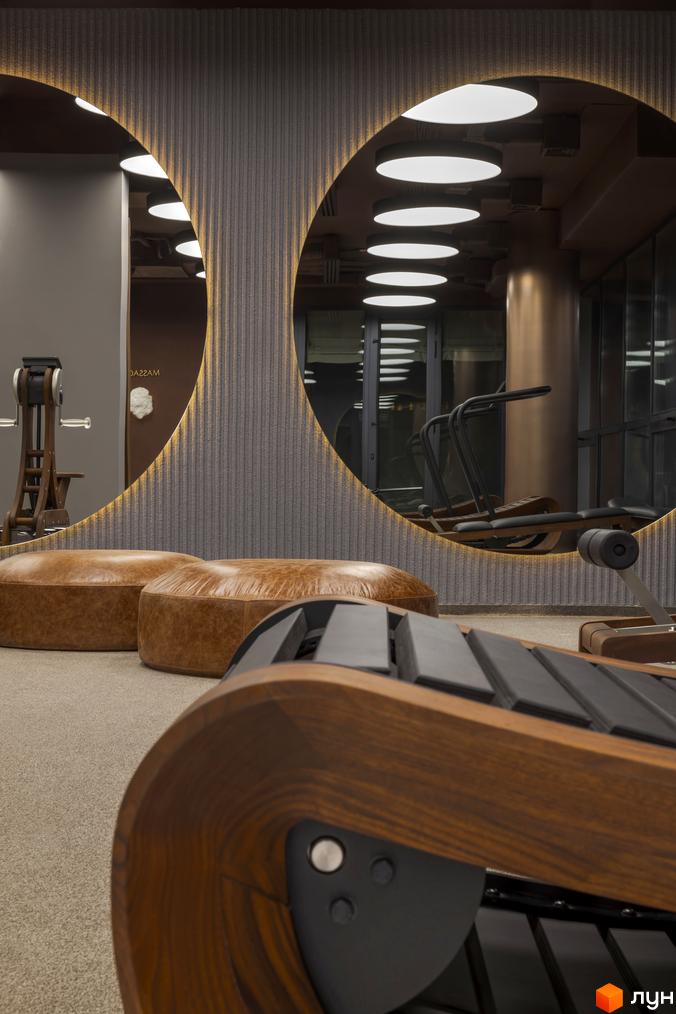 Житловий комплекс Avalon Prime з елегантним дизайном інтер'єру та зонами відпочинку. Сучасне оздоблення стін та освітлення створюють затишну атмосферу.