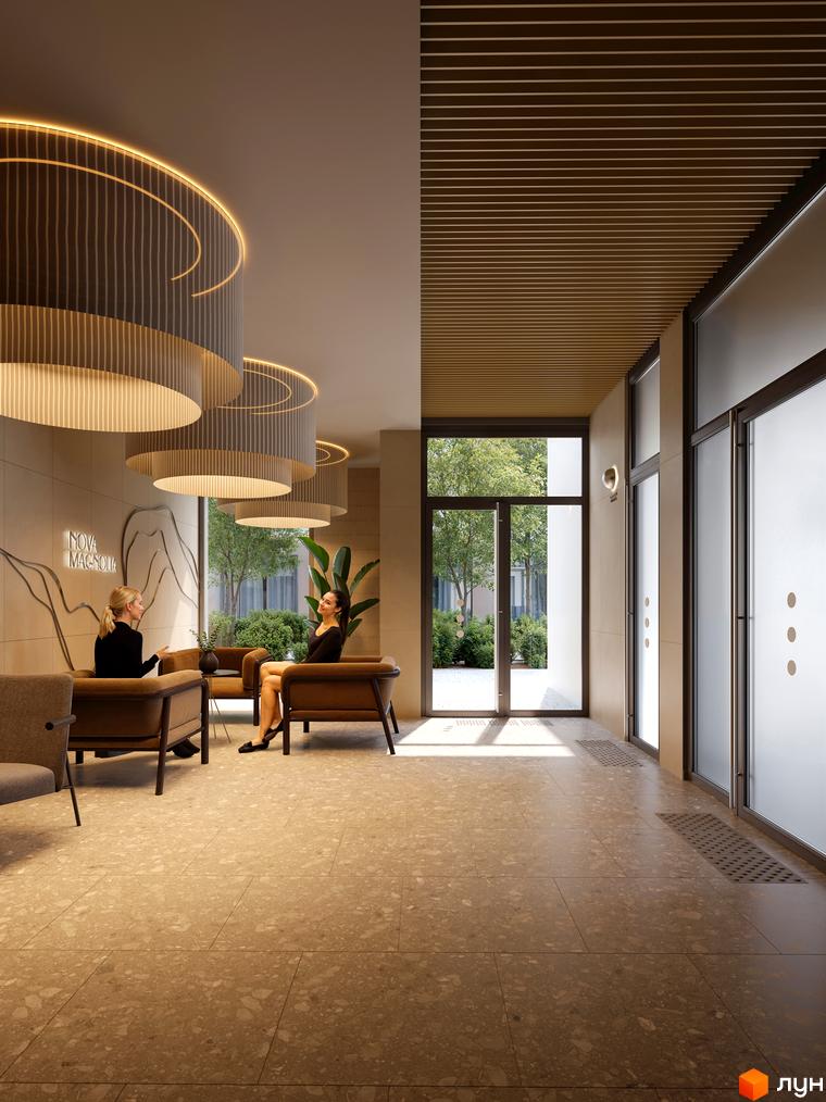 Просторий хол Житлового комплексу Avalon Magnolia з великими вікнами та видом на озеленену територію. Стеля має підвісні світильники.