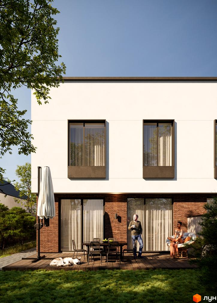 Зовнішній вигляд дуплексу Loft House з терасою, де відпочивають люди. Навколо будинку зелений газон та дерева.