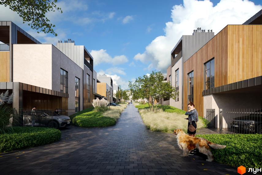 Котеджне містечко VILLA VISTA. Зовнішній вигляд будинків з дерев'яними та бетонними фасадами, доріжка з бруківки та зелена прибудинкова територія.