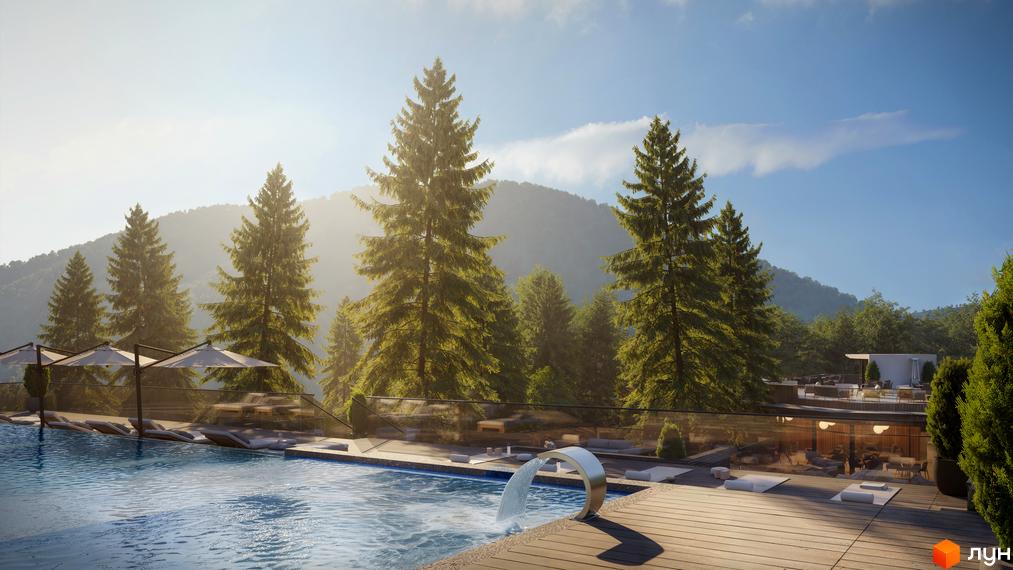 Котеджне містечко GORA: басейн з водоспадом і зоною відпочинку на тлі гірського пейзажу з ялинами. На території комплексу розташовані тераси з парасольками та шезлонгами.