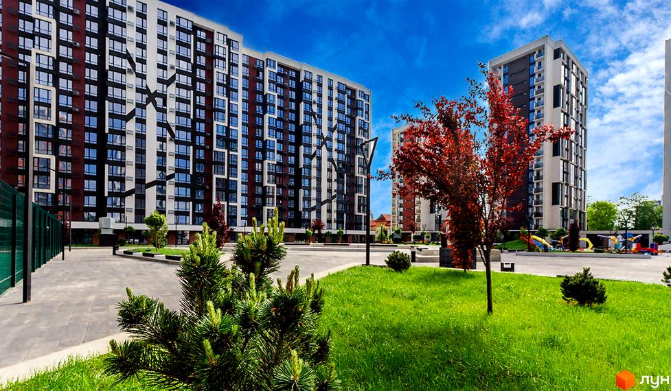 Житловий район Manhattan - сучасні багатоповерхові будинки з панорамними вікнами та доглянутою прибудинковою територією з зеленими насадженнями та дитячим майданчиком.