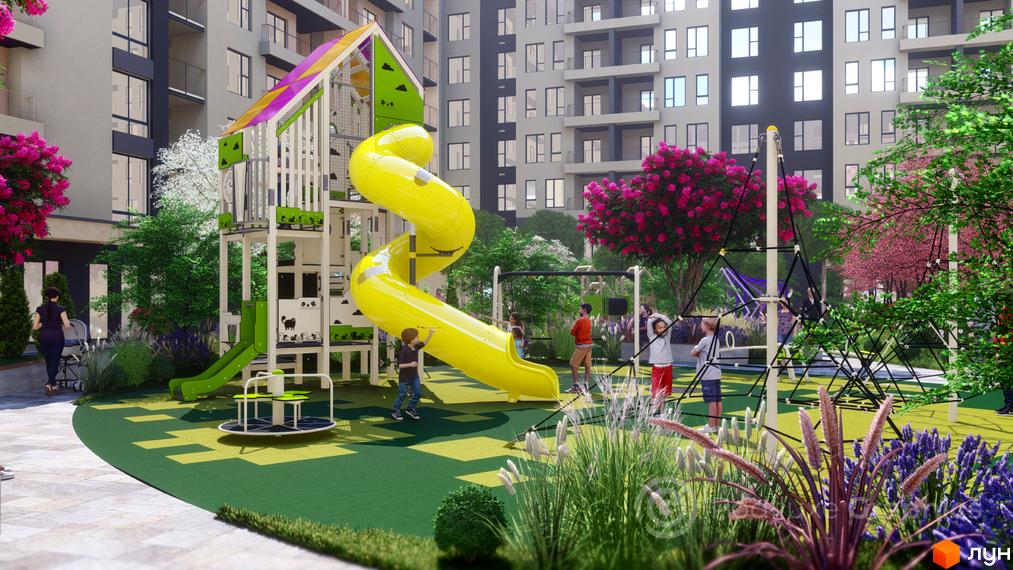 Дитячий майданчик у житловому комплексі GARDEN CITY із яскравою гіркою та зонами для ігор. Навколо зелені насадження та сучасні багатоповерхові будинки.