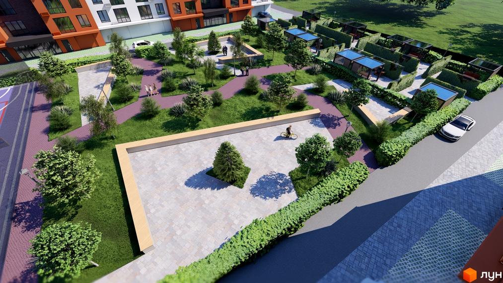 Зображення Житлового комплексу Перлина Проскурова-5 з висоти пташиного польоту. На фото будівля та зелений двір з місцем для відпочинку.