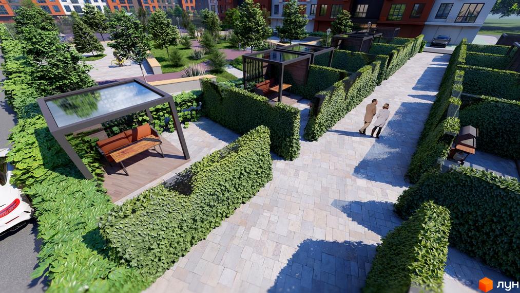 Вигляд на Житловий комплекс Перлина Проскурова-5 з прибудинковою територією, де є місця для відпочинку та прогулянкові алеї.