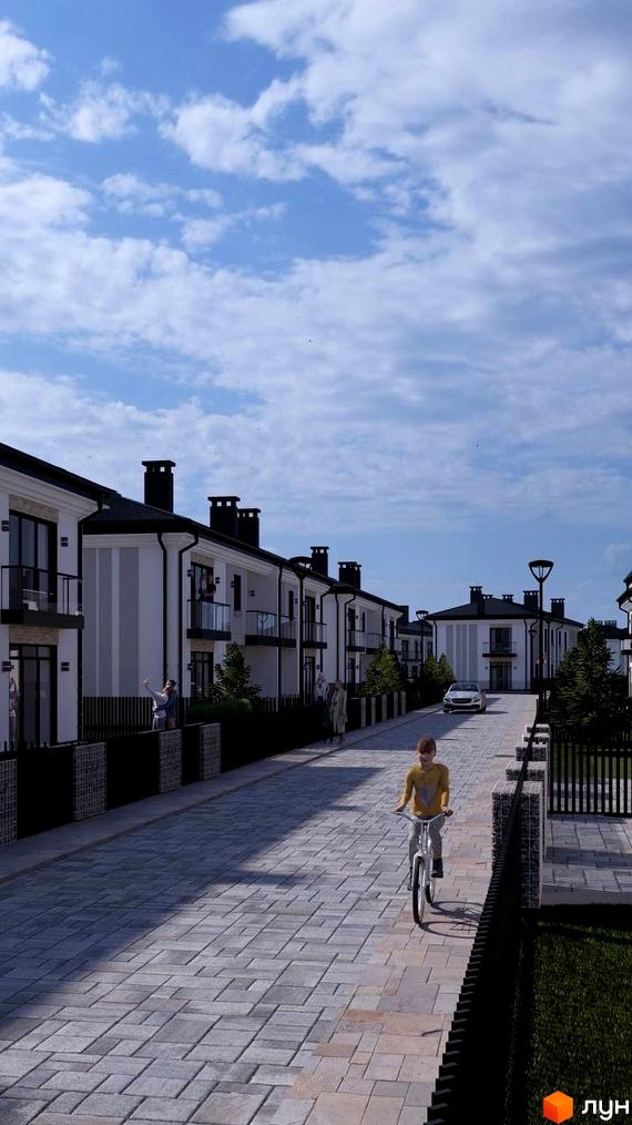 Котеджне містечко Нові Вовчинці: двоповерхові будинки з чорними дахами та балконами, асфальтована вулиця з бруківкою та зелені насадження.