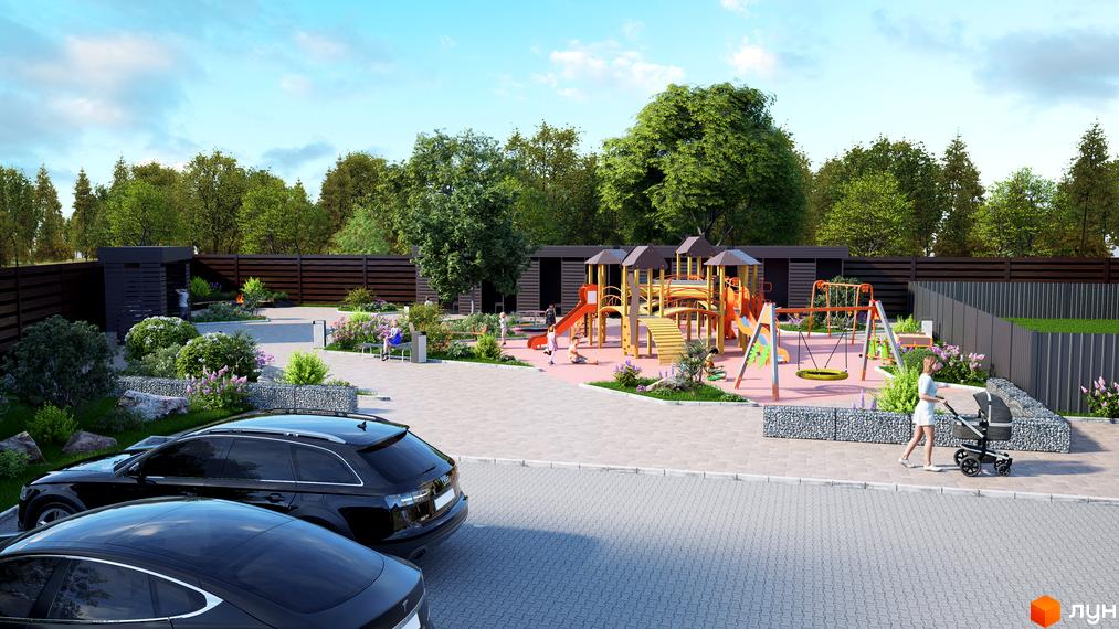 Задні фасади таунхаусів Eurovillage за дерев'яною огорожею. На прибудинковій території розташовані дитячий майданчик, зелені насадження та парковка.