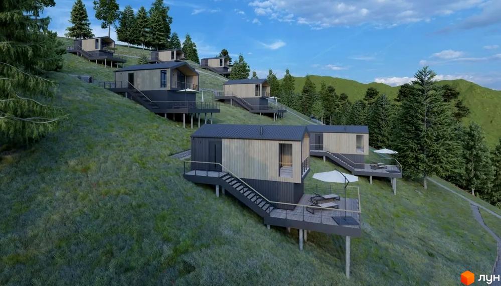 Котеджне містечко Genesis Mountain на схилі гори з дерев'яними фасадами та терасами. Навколо зелена трава та високі дерева.