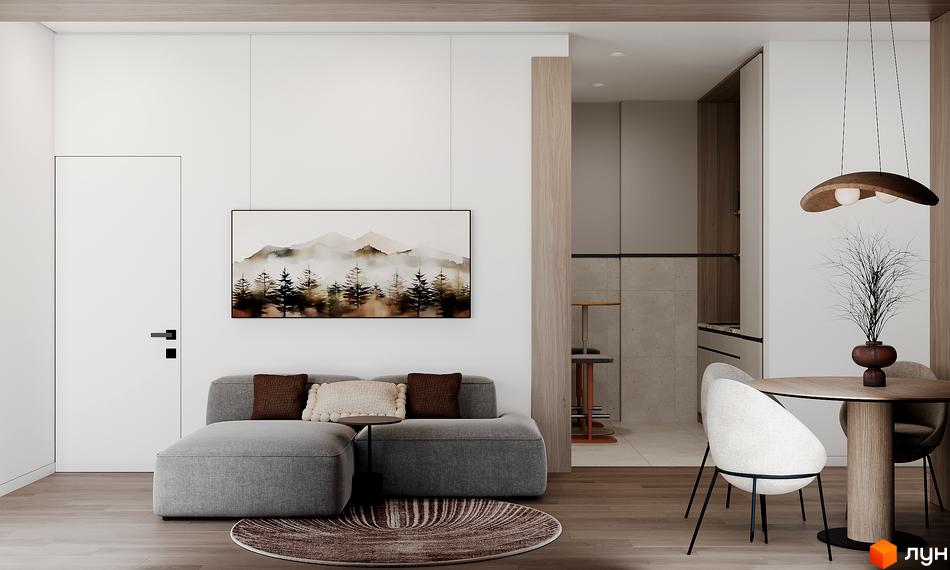 Інтер'єр вітальні з сірим диваном та картиною з гірським пейзажем. Поруч обідня зона з круглим столом та кріслами.