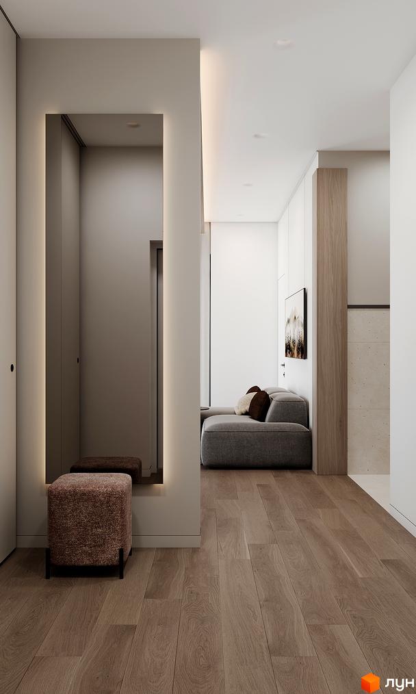 Сучасний інтер'єр квартири в ЖК GRONO Family Residence з великим дзеркалом та зручним диваном. Просторий коридор з дерев'яною підлогою та приємним освітленням.