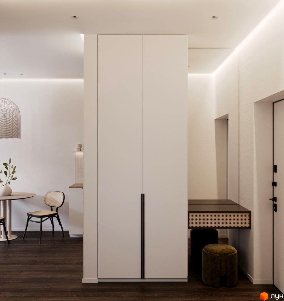 Інтер'єр квартири в ЖК GRONO Family Residence з білими шафами, туалетним столиком та стільцями. Оздоблення виконане в спокійних тонах.